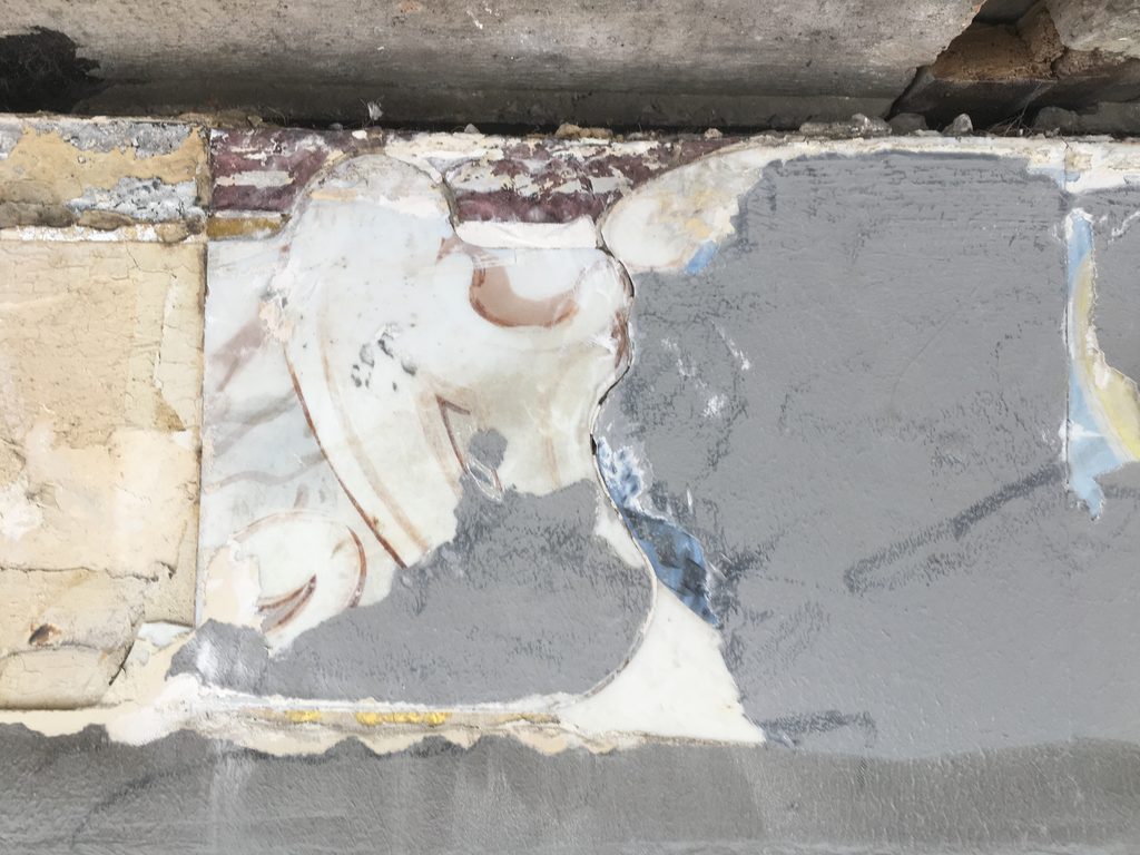 Decorative enamel-painted glass panels painted over with grey wall paint, because they was damaged over the years.